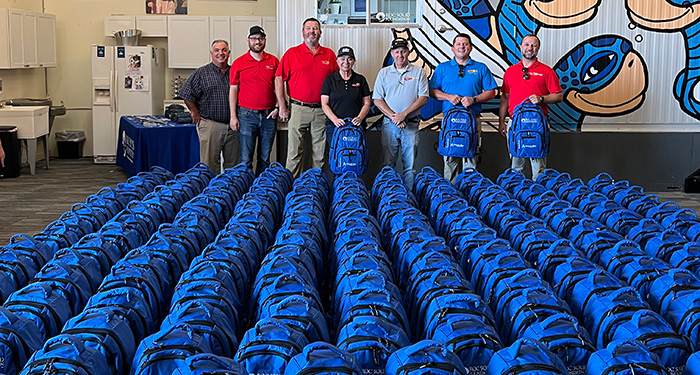 Carter Machinery Team Members with Care Bags